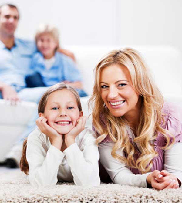 Happy family spending time on a clean carpet