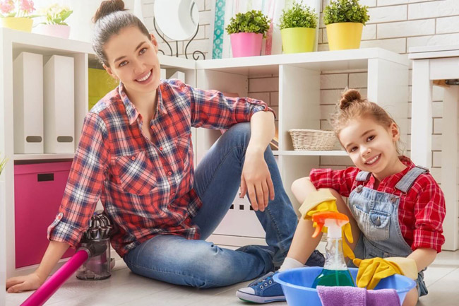 Woman and little daughter doing end of lease cleaning