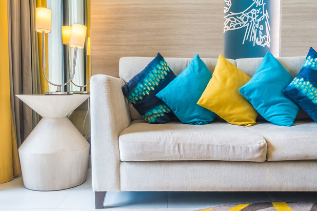 Clean sofa and pillow after upholstery cleaning